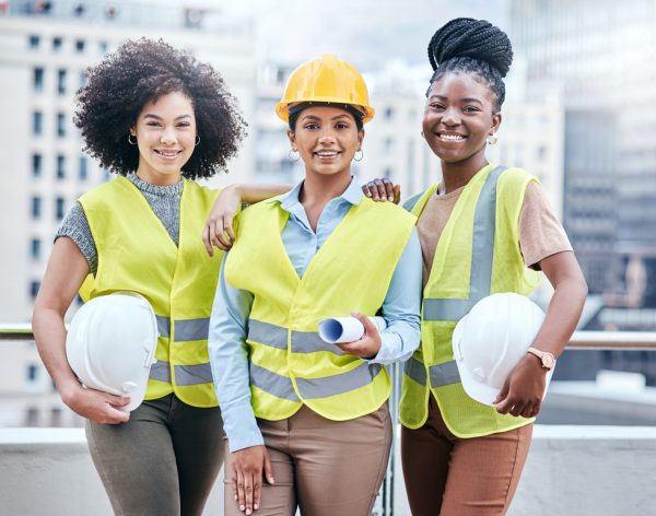 Portrait of a group of confident young businesswomen working at a construction site.