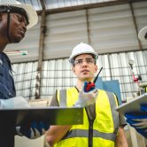 Testing new automation innovation tool for smart industrial, Professional robotic engineers specialist maintenance and control robot arm in factory warehouse, technician teamwork working together